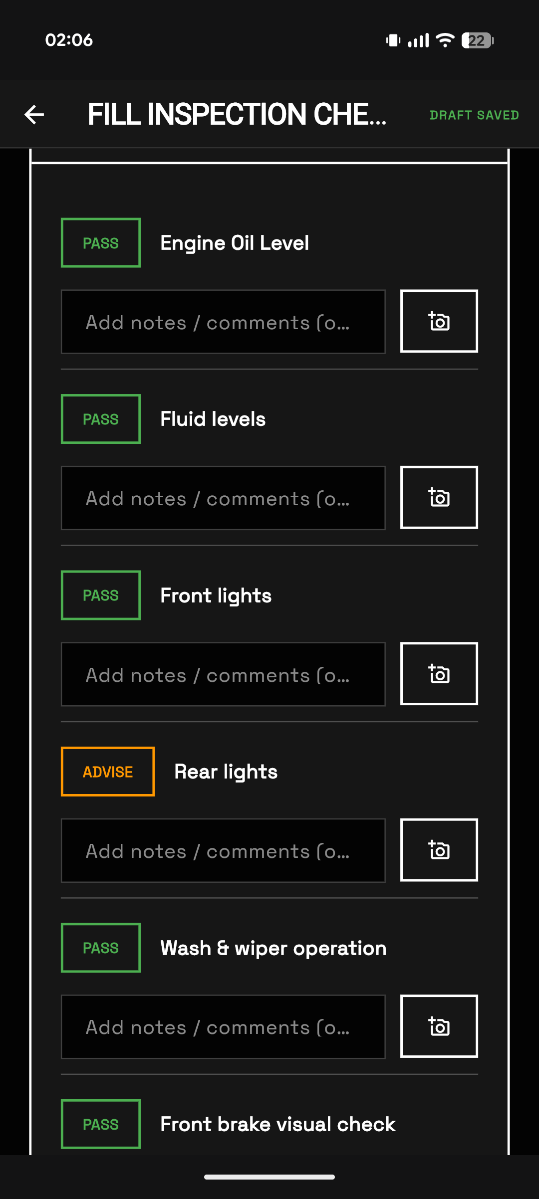 eGarage mobile vehicle checklist execution screen with PASS ADVISE statuses and photo camera attachment button